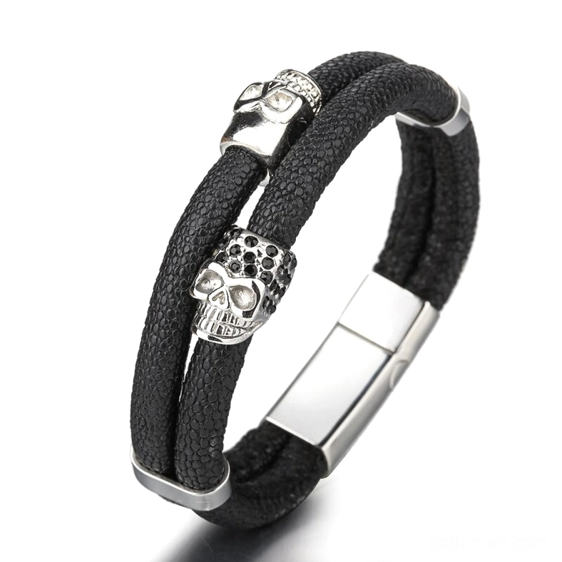 Silver stainless steel magnetic skull bracelet with black leather strap and silver skull ornaments, side profile