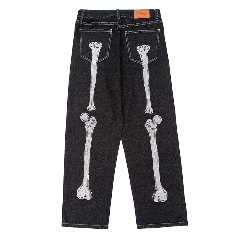 Skeleton hand bone print gothic jeans rear view, black distressed denim with bone embroidery on back pockets