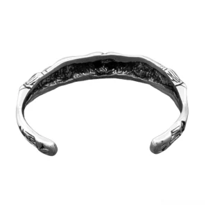 Open skeleton cuff bracelet interior showing engraved details and bone anatomy carving – unisex gothic jewelry inside view