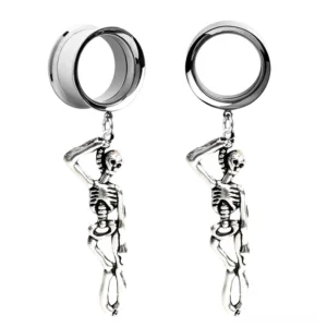 Pair of skeleton dangle ear tunnels in bright silver stainless steel with double-flared tunnel design, flat lay front view on white background