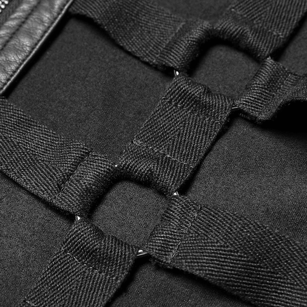 Close-up of lattice skeleton cutout harness front with woven black fabric straps and grid pattern