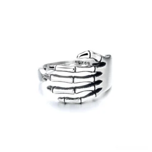 Adjustable skeleton hand wrap ring, front facing view showing open band design with anatomically detailed skeletal fingers in antique silver
