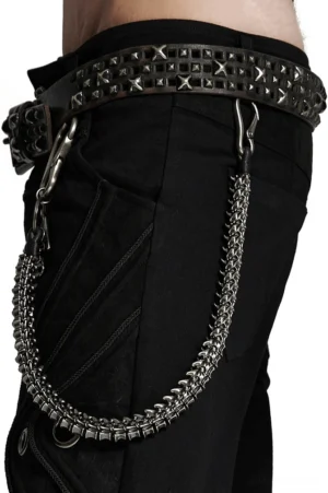 Skeleton spine waist chain front view worn with studded belt on male model against white studio background