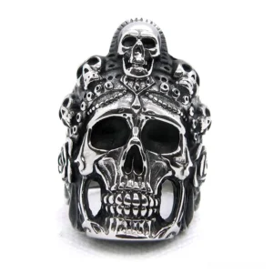 Stacked skull gothic ring frontal top-down view showcasing ornate carved skull details and decorative engravings on stainless steel band