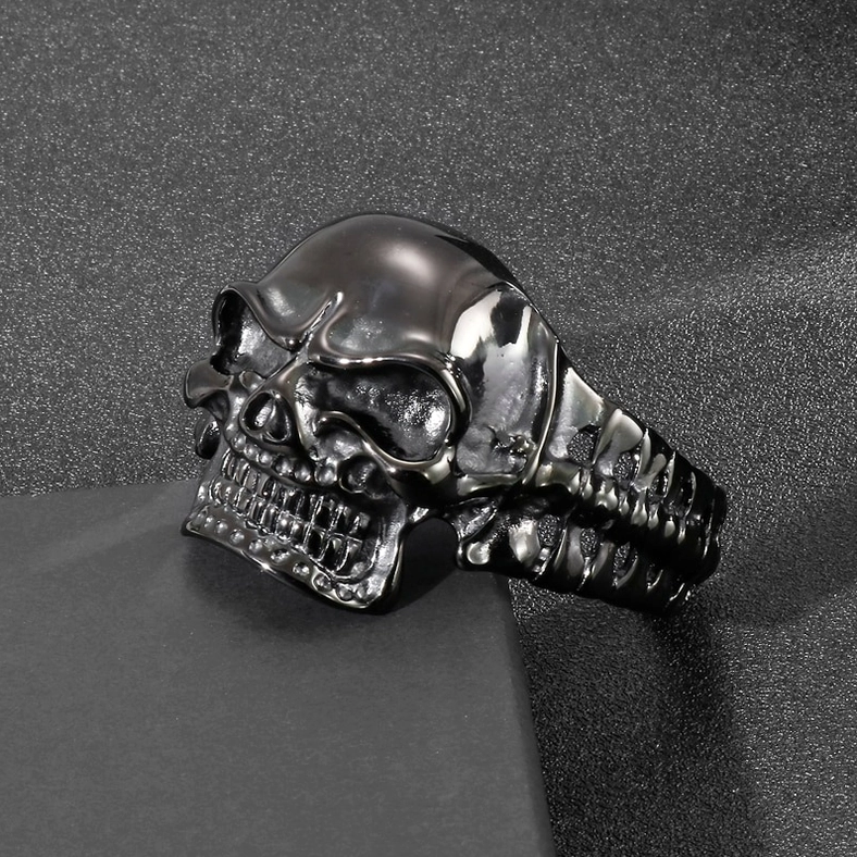 Stainless steel skull bracelet front oblique view on display stand with realistic skull facial details