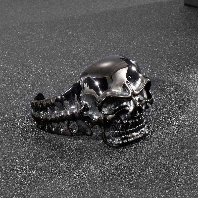 Black skull cuff bracelet side three-quarter view displaying spine-textured band pattern