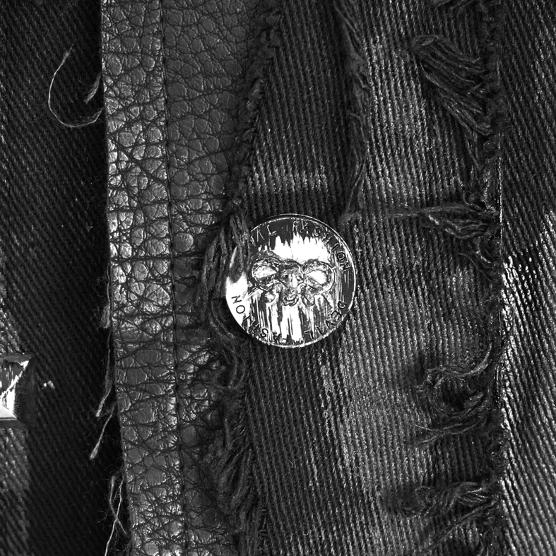 Skull embossed metal button hardware and mixed denim leather fabric texture on waistcoat