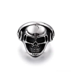 Skull headphone biker ring front view, polished stainless steel with detailed carved skull and music headphone design