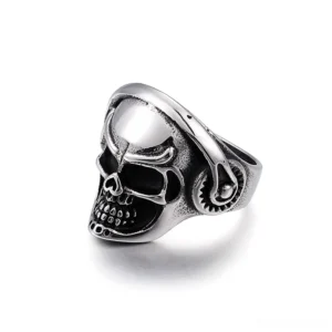 Skull headphone punk ring three-quarter side angle, showing gear details and mixed finish texture on stainless steel band