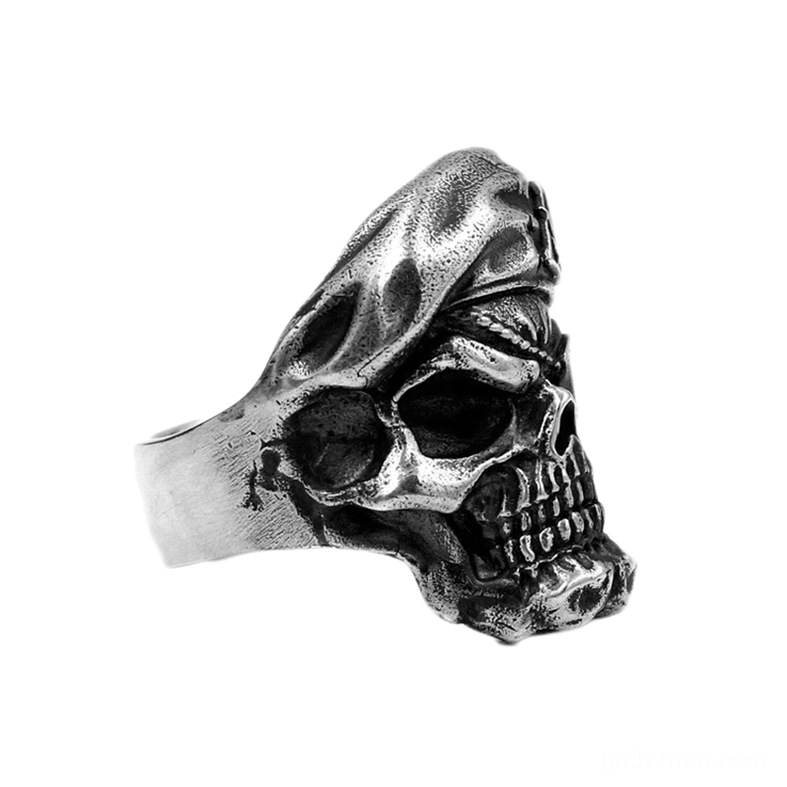 Skull ring left rear three-quarter perspective showing skull profile and crafted metal detail of alternative men's jewelry
