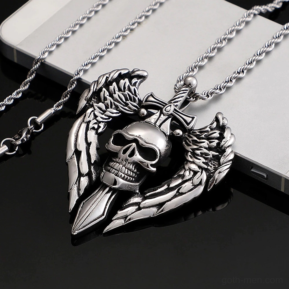 Side profile angle of gothic angel wing skull pendant necklace on smartphone surface showing dimension and depth