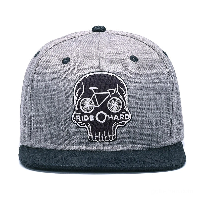 Skull ride hard gothic snapback cap front view, displaying embroidered skull with bicycle and RIDE HARD text on heather gray 6-panel baseball cap with black flat brim
