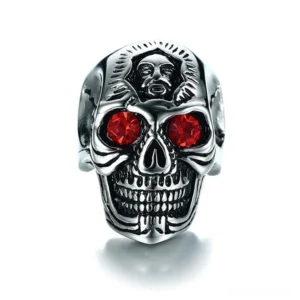 Detailed frontal view of alternative fashion skull ring featuring vivid crimson zirconia stones and distressed silver finish