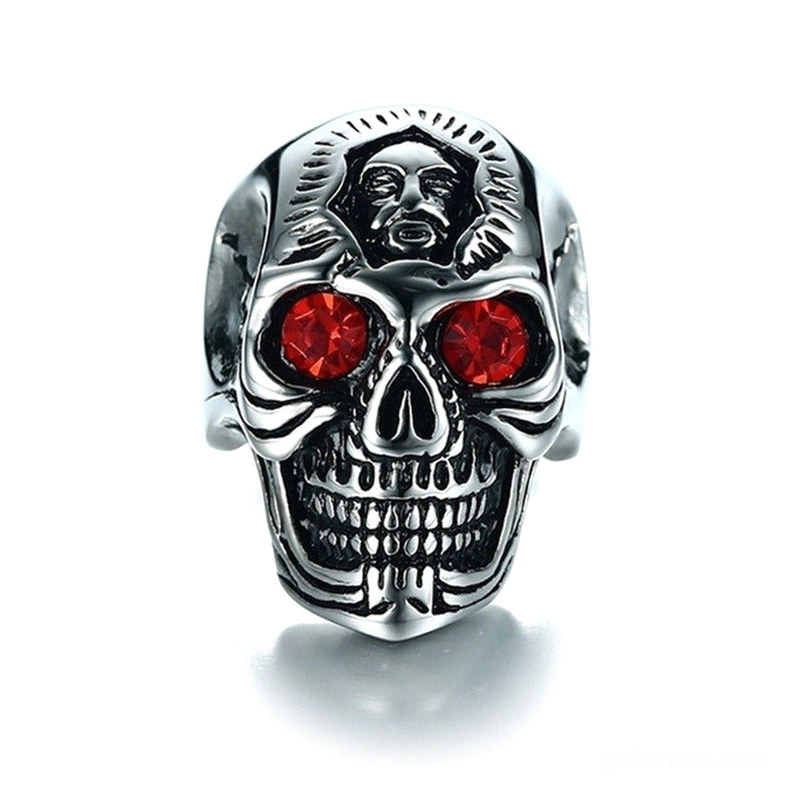 Detailed frontal view of alternative fashion skull ring featuring vivid crimson zirconia stones and distressed silver finish