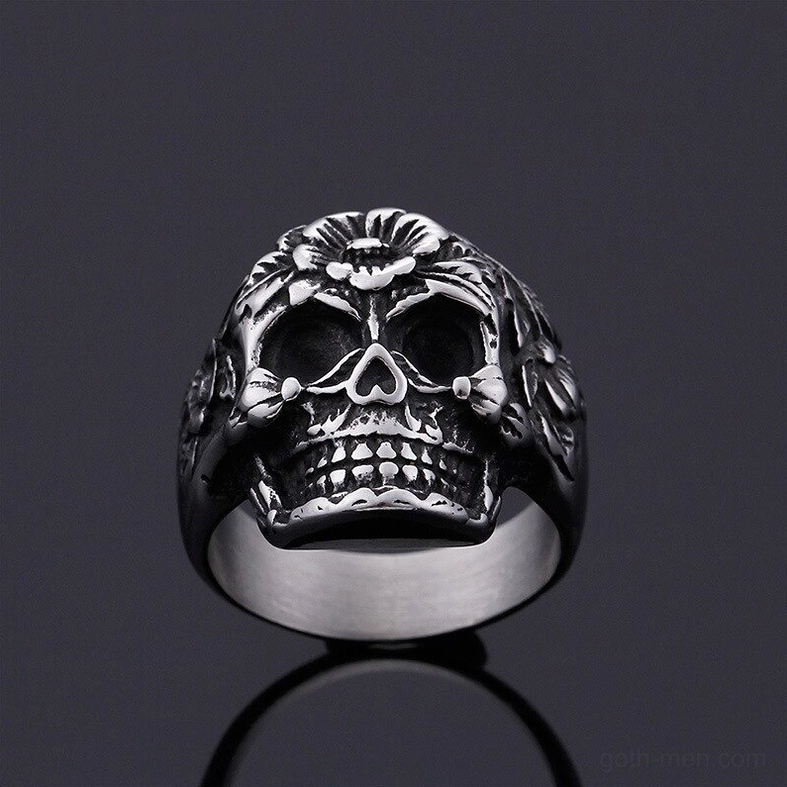 Embossed floral skull ring overhead front view, clear flower motif details, gothic statement ring, stainless steel