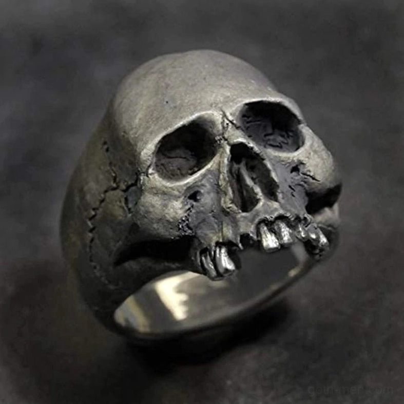 Skull ring low angle view showing full carving and polished inner band surface detail