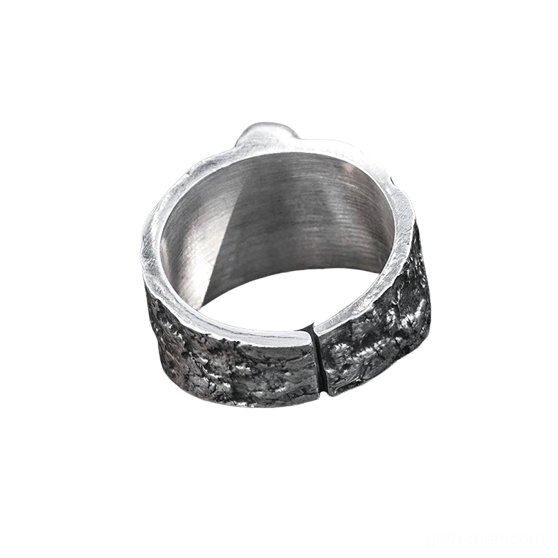Interior side view of adjustable gothic ring showing smooth brushed inner band and textured outer surface