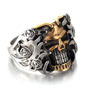 Dual-tone skull rose gothic ring front three-quarter view, silver and gold two-tone design with intricate rose and flame carvings, memento mori jewelry for men