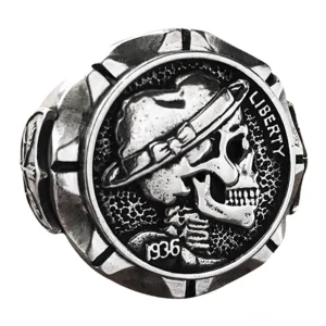 Biker skull ring front close-up detail view showcasing intricate face engraving and matte silver texture with faceted ring edges