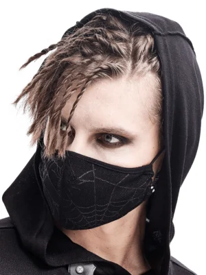 Male model wearing black gothic spiderweb face mask with braided hair, front half-face view on white background