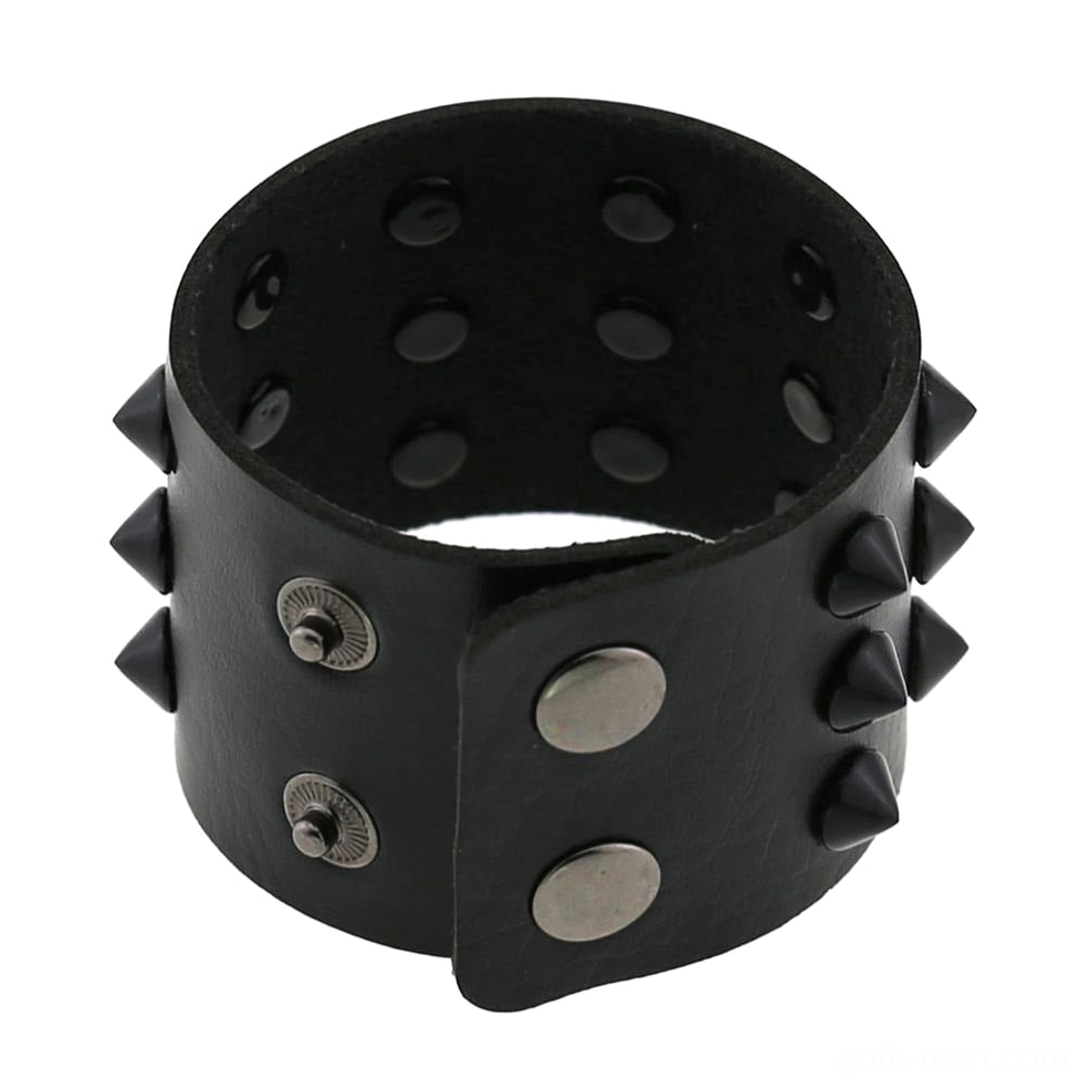 Spike studded wrap bracelet interior top-down view showing adjustable rivet holes and metal snap fastener system