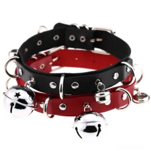 Multiple stacked gothic chokers with silver bells and rivets - flat lay top-down view