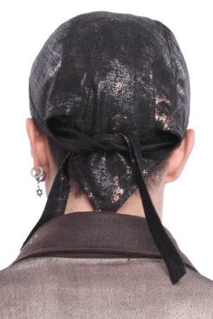 Steampunk head wrap worn from behind showing extended fabric tail and marbled black-bronze textile pattern