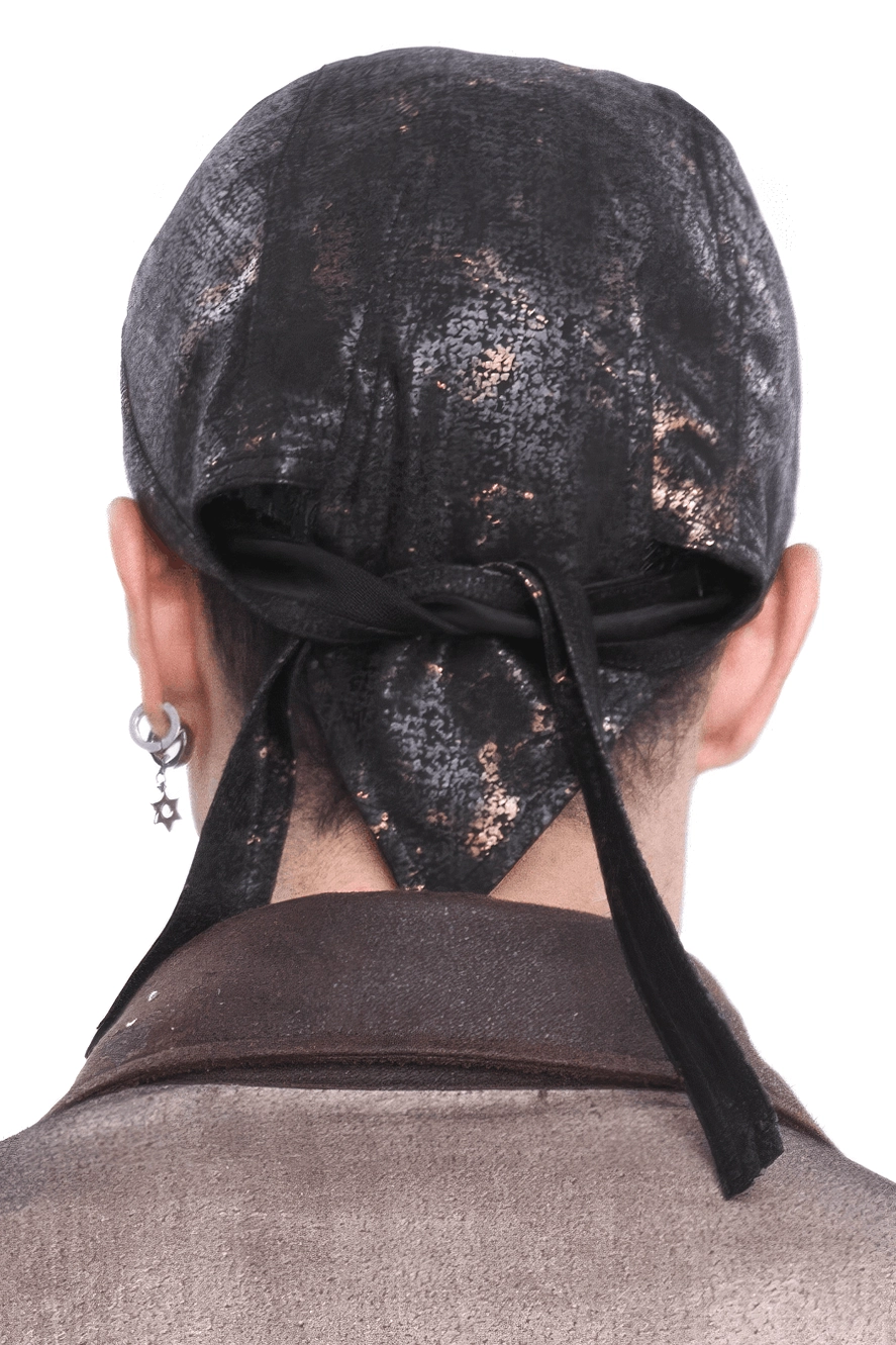 Steampunk head wrap worn from behind showing extended fabric tail and marbled black-bronze textile pattern