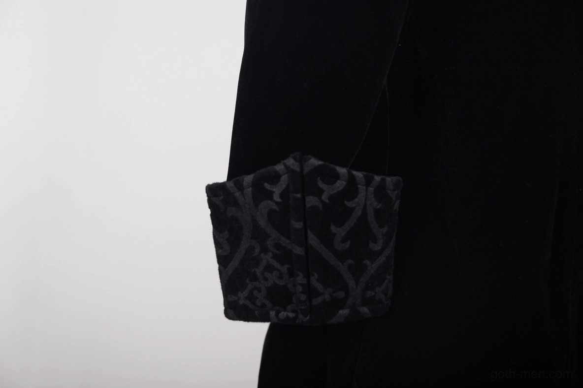 Gothic steampunk coat construction detail showing seams, embroidered cuffs, and metal hardware