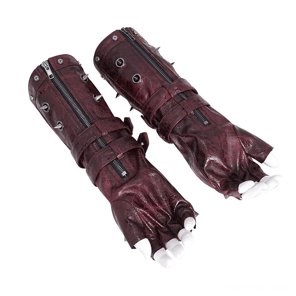 Pair of steampunk gothic gauntlet gloves three-quarter flat lay view showing forearm zipper, metal spikes, and adjustable buckle straps