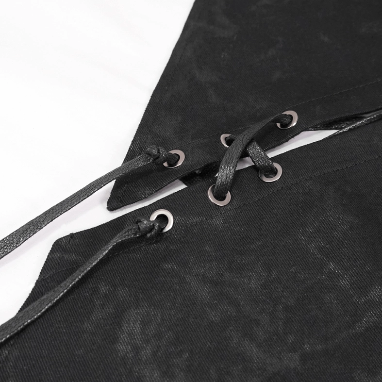 Detailed shot of decorative metal eyelets and leather lacing on black distressed fabric of steampunk kilt