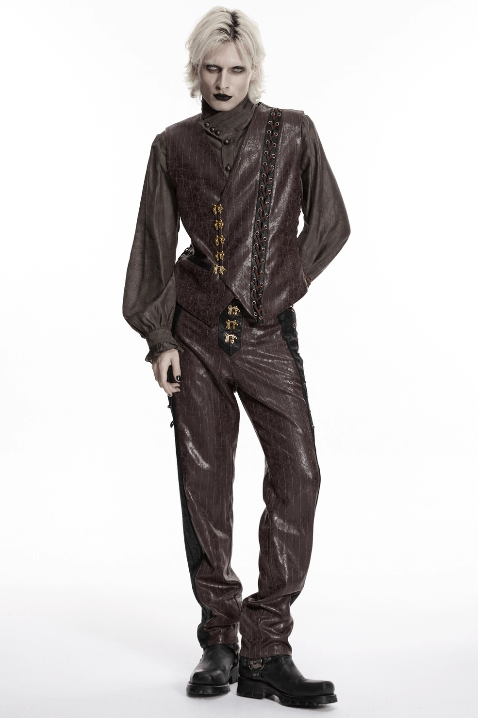 Detail view of steampunk pants construction showing brown and black faux leather layering and professional tailoring