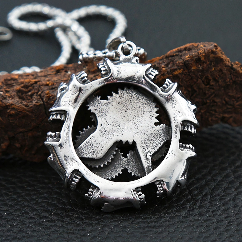 Back side of mechanical skull pendant revealing engraved gear pattern and dual-sided steampunk design details