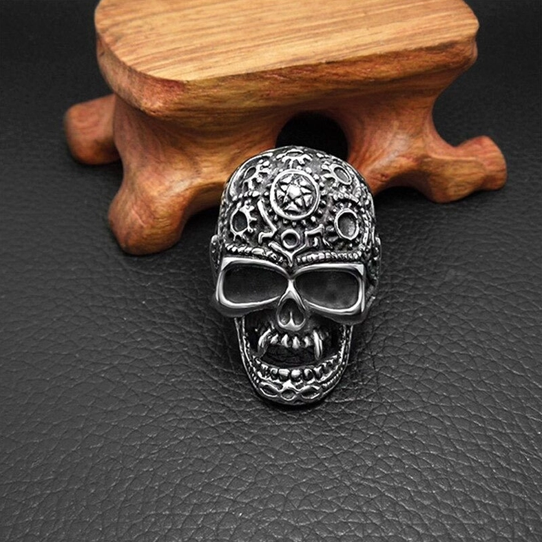 Direct front steampunk skull ring vintage aged metal finish with full carved gear design on wood display