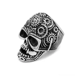 Steampunk gear skull ring stainless steel left three-quarter view showing engraved gears and fangs gothic statement jewelry