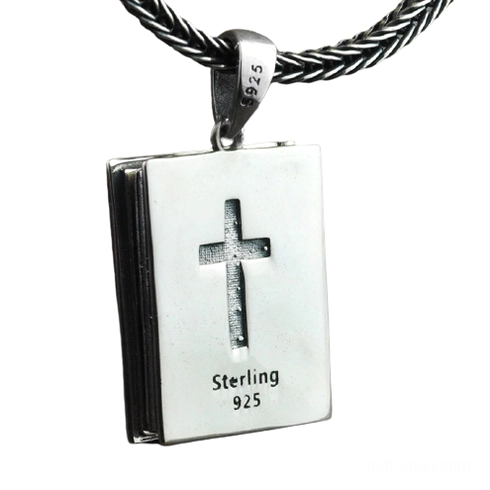 Front flat view of sterling silver religious bible locket pendant displaying embossed cross and 925 silver hallmark stamp