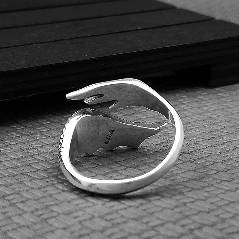 Open wing sterling silver gothic ring rear oblique view displaying S925 stamp and simple smooth ring band detail