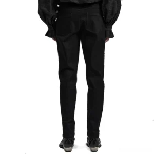 Rear view of black gothic studded denim pants showing back pockets and waist decoration straps
