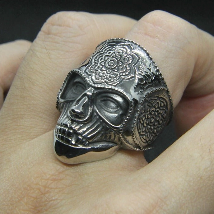 Gothic mandala skull ring fitted on finger showing authentic aged silver patina and complete engraved design in daily wear context