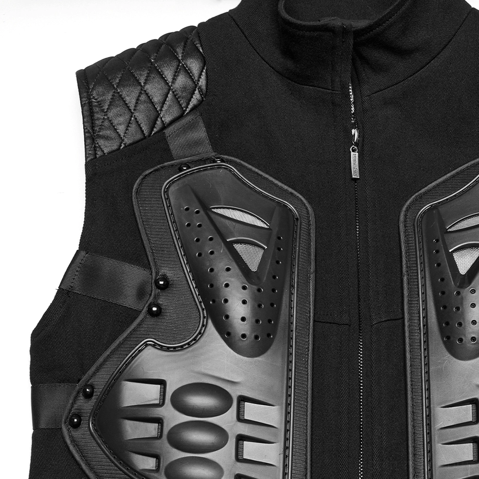 Close-up detail of perforated 3D rubber armor chest panels on tactical vest