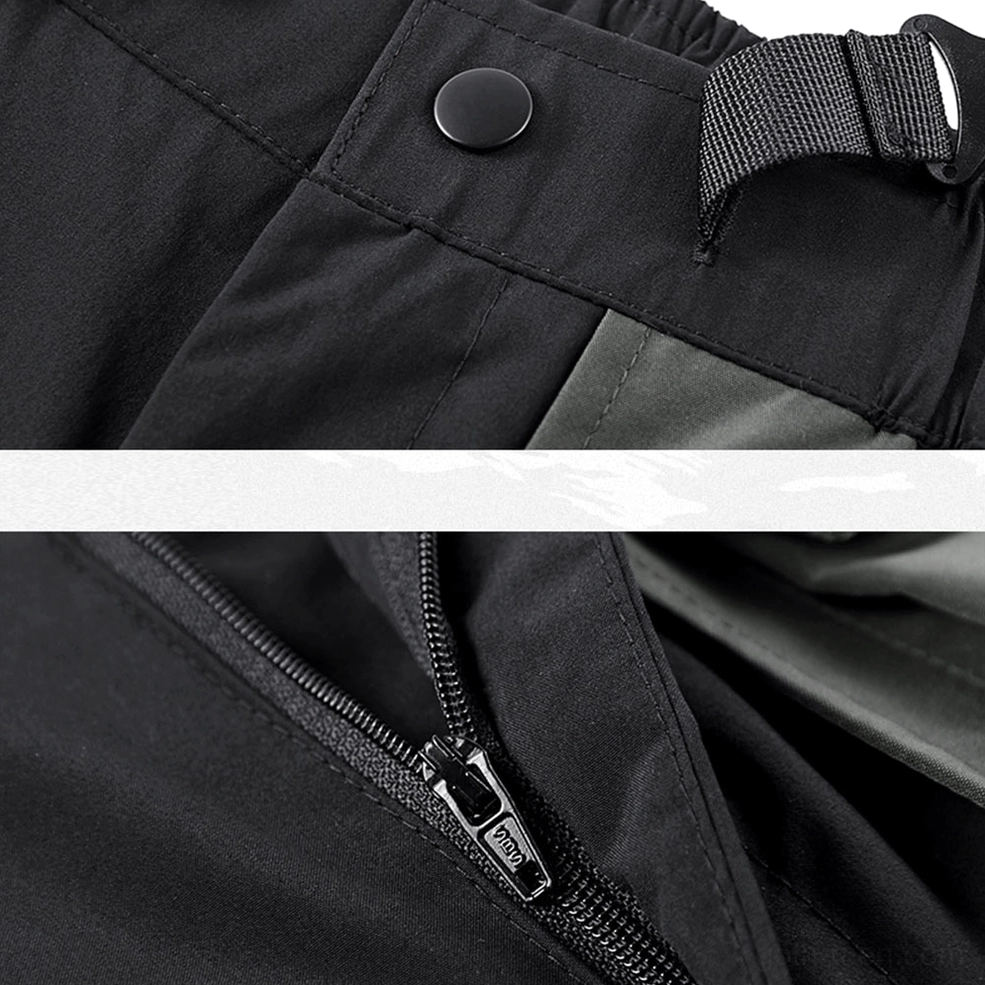 Metal zipper and hidden snap fastener closure detail on black tactical cargo shorts