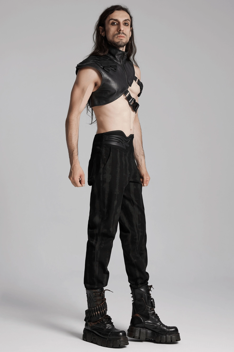 Product display of cyberpunk tactical shoulder harness in black rubberized fabric for goth subculture fashion