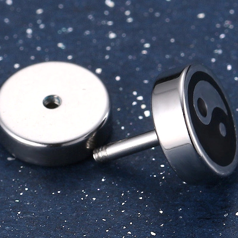 Single Tai Chi stud earring showing front pattern and back screw-on post, surgical grade stainless steel mirror finish