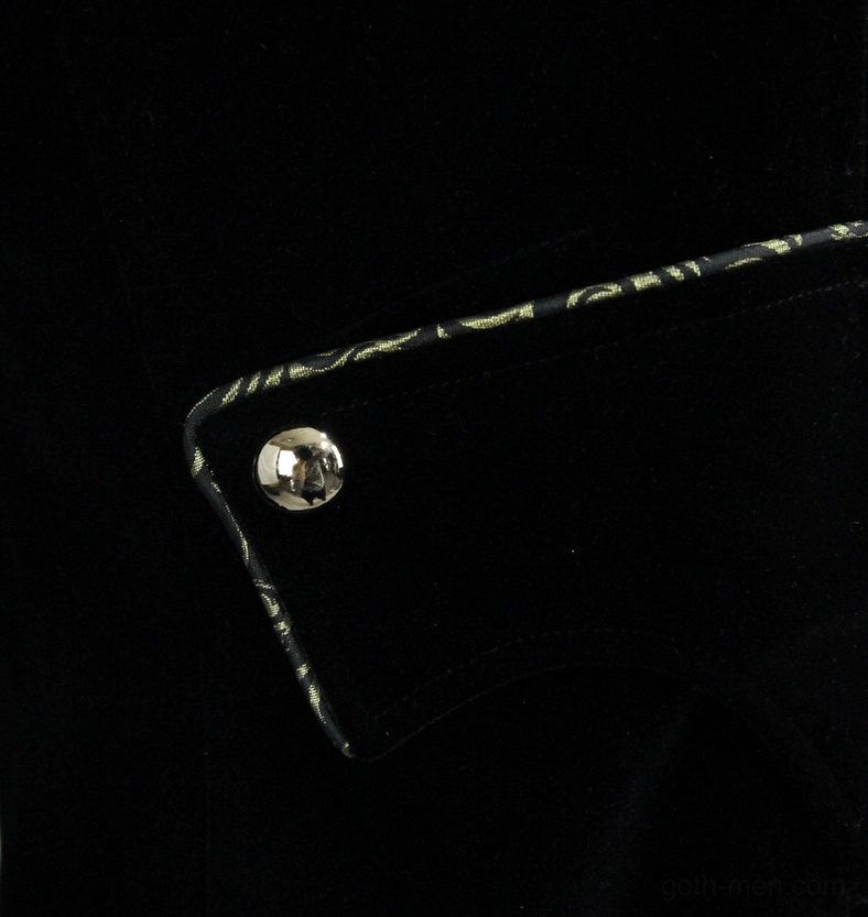 Cuff detail of black velvet tailcoat showing metal snap button and gold embroidered trim finishing