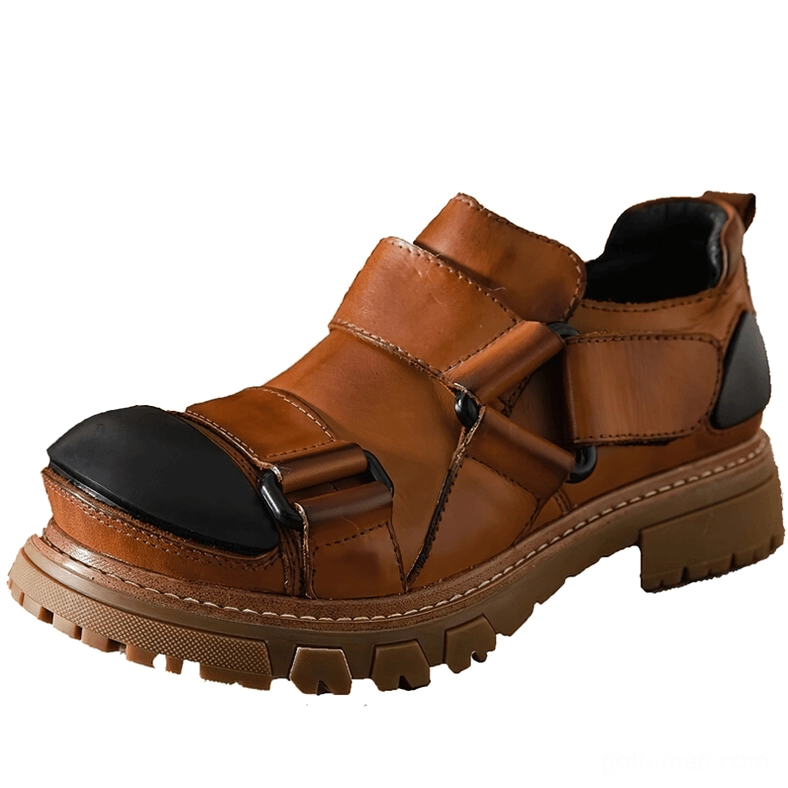Tan brown distressed leather gothic work-inspired loafers with velcro straps and brown lug sole, protective toe cap detail