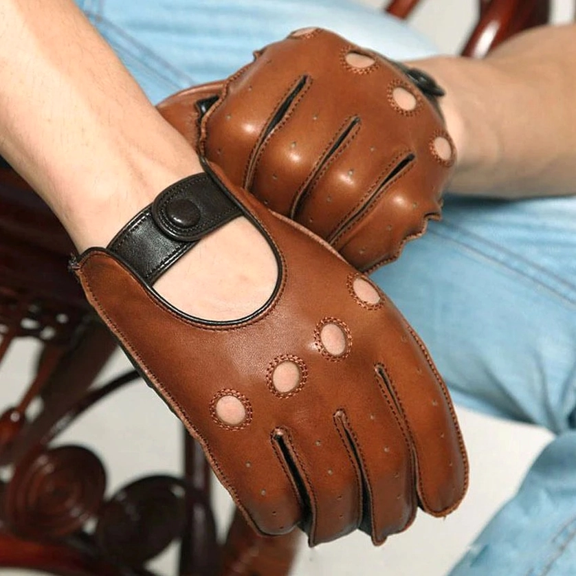 Front close-up of tan brown genuine goatskin leather gloves worn with blue denim showing gothic aesthetic and circular ventilation holes