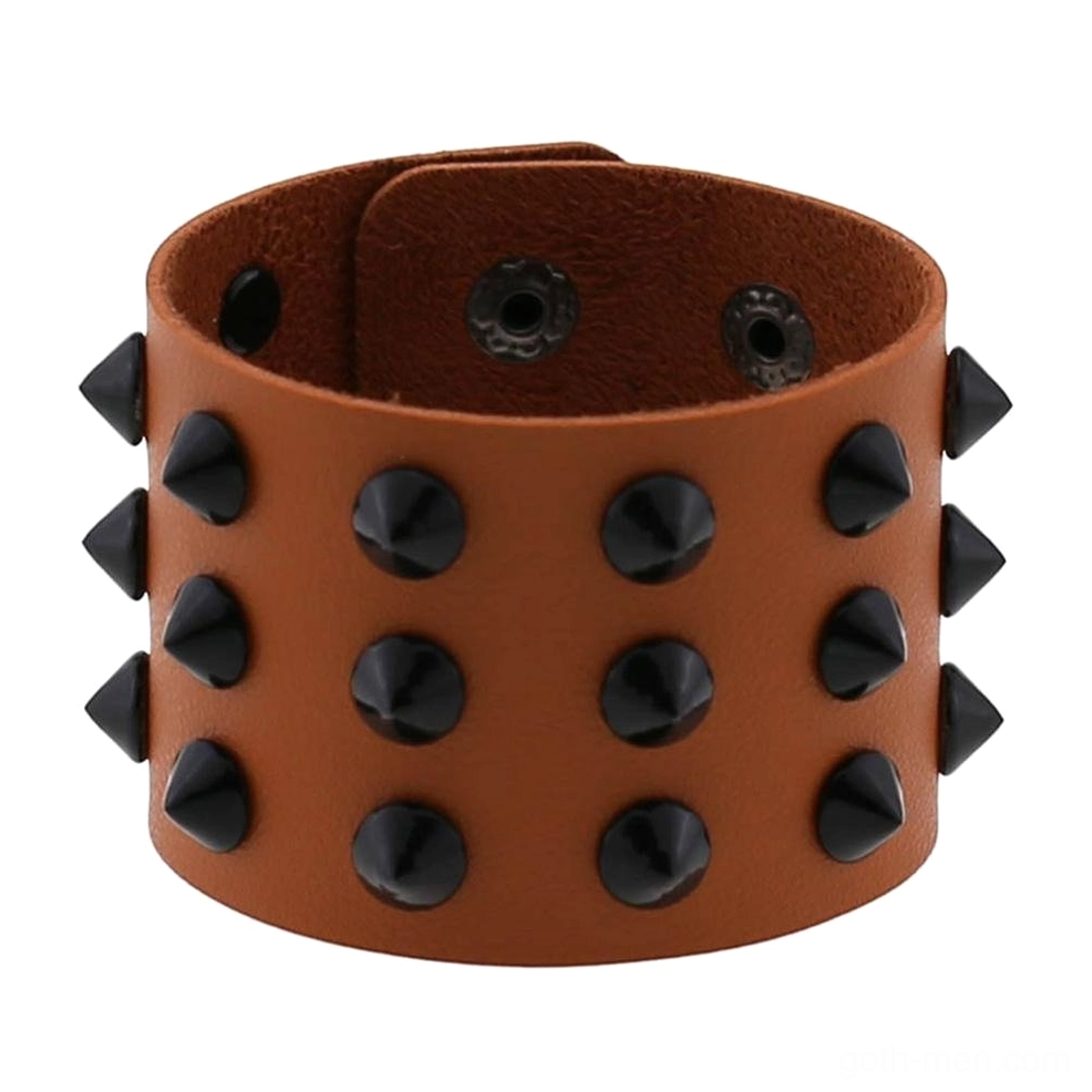 Tan brown vegan leather gothic spike bracelet front view showing metallic cone spike arrangement