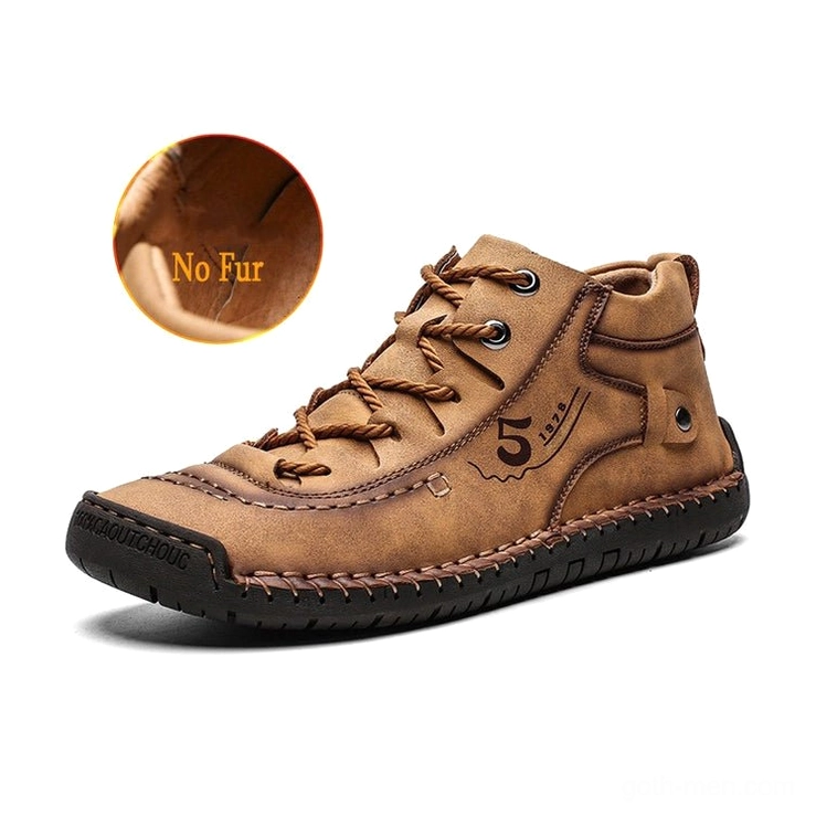 Tan gothic ankle boots featuring reinforced rubber sole and hand-stitched authentic leather craftsmanship