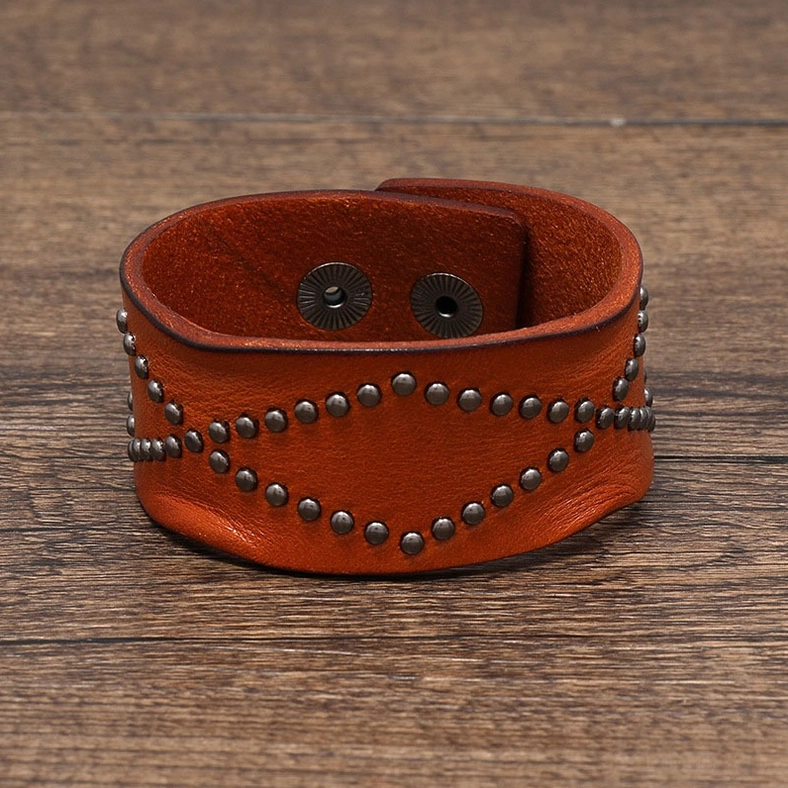 Light brown leather gothic cuff bracelet overhead flat view showing complete rivet geometry and snap fastener