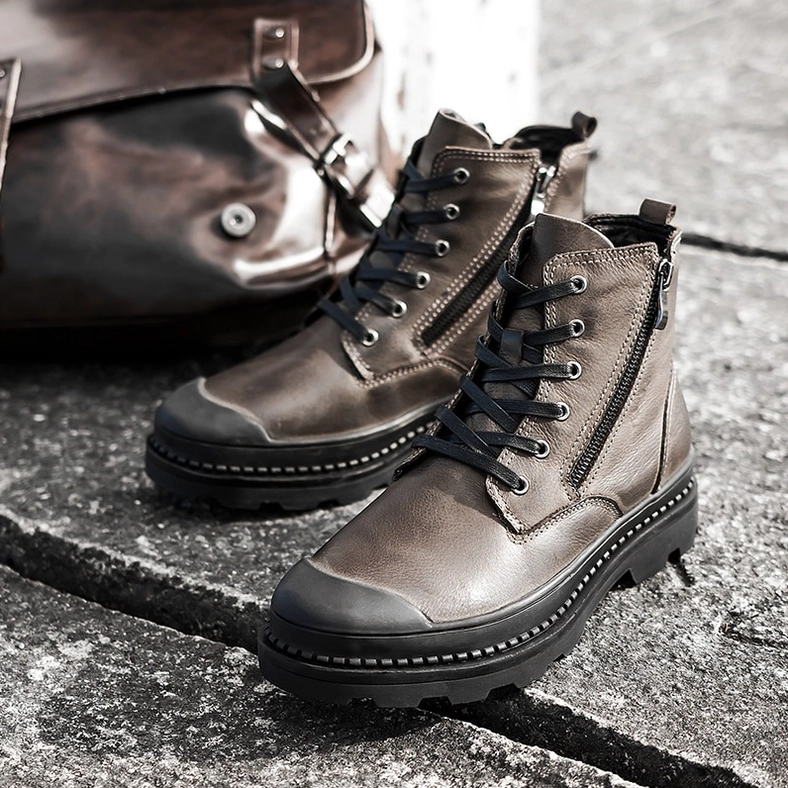 Taupe leather gothic combat boot detail showing dual closure system with both lace-up and side zipper functionality